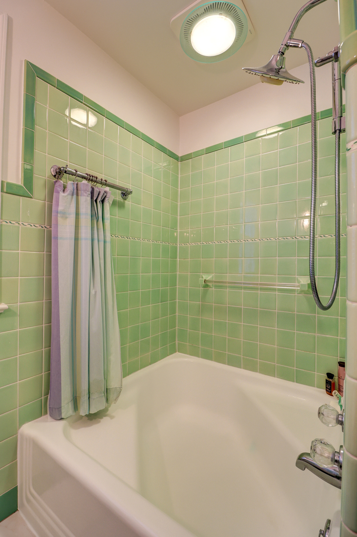 411 West 13th Street Sterling, IL 61081 - Photo 27 of 53 a bathroom with a sink and a shower