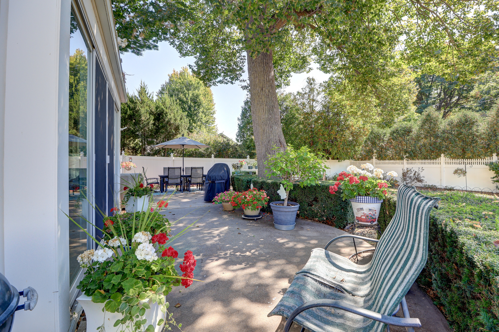 411 West 13th Street Sterling, IL 61081 - Photo 37 of 53 a view of a chairs and table in a backyard