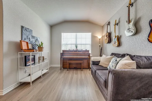 a bedroom with furniture and a window