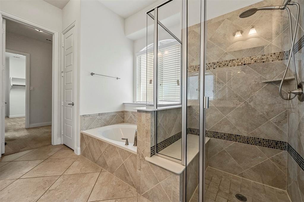 3000 Crestwater Ridge Keller, TX 76248 - Photo 17 of 22 a bathroom with a bathtub and a shower