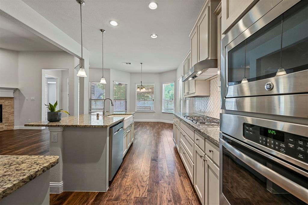 3000 Crestwater Ridge Keller, TX 76248 - Photo 2 of 22 a kitchen with stainless steel appliances granite countertop a stove a sink and a refrigerator