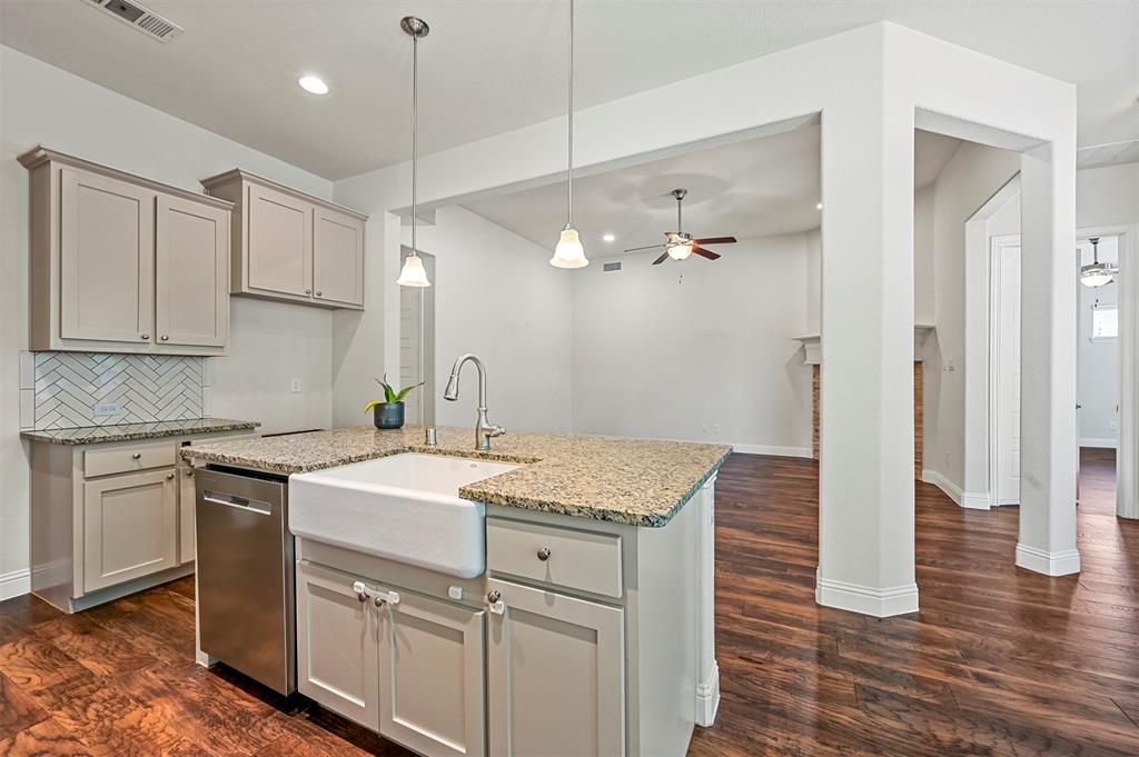 3000 Crestwater Ridge Keller, TX 76248 - Photo 5 of 22 a kitchen with a sink cabinets stainless steel appliances and a counter top space