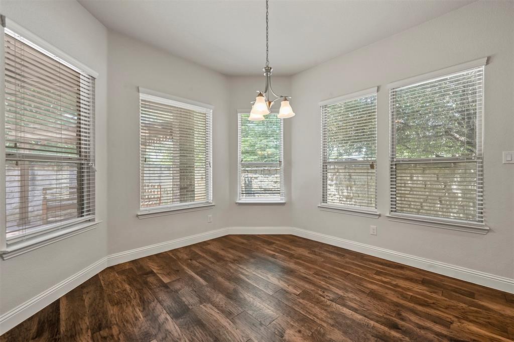 3000 Crestwater Ridge Keller, TX 76248 - Photo 6 of 22 a view of an empty room with wooden floor and a window