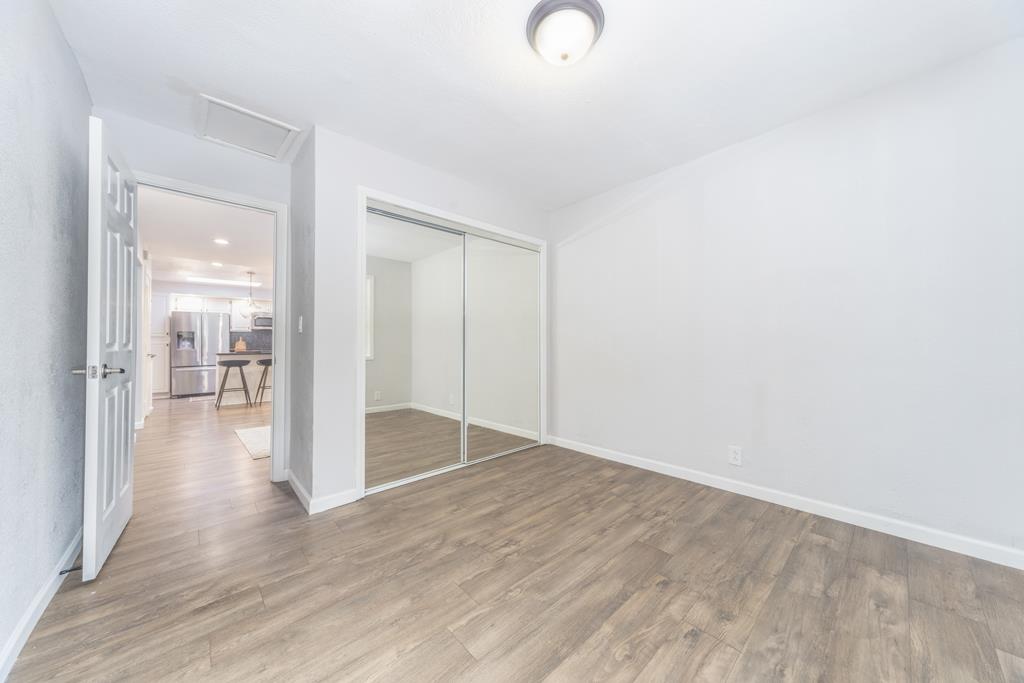 370 Monterey Road Pacifica, CA 94044 - Photo 11 of 31 a view of a hallway with wooden floor