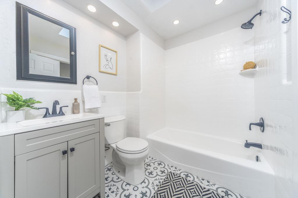 370 Monterey Road Pacifica, CA 94044 - Photo 12 of 31 a bathroom with a sink a toilet and shower