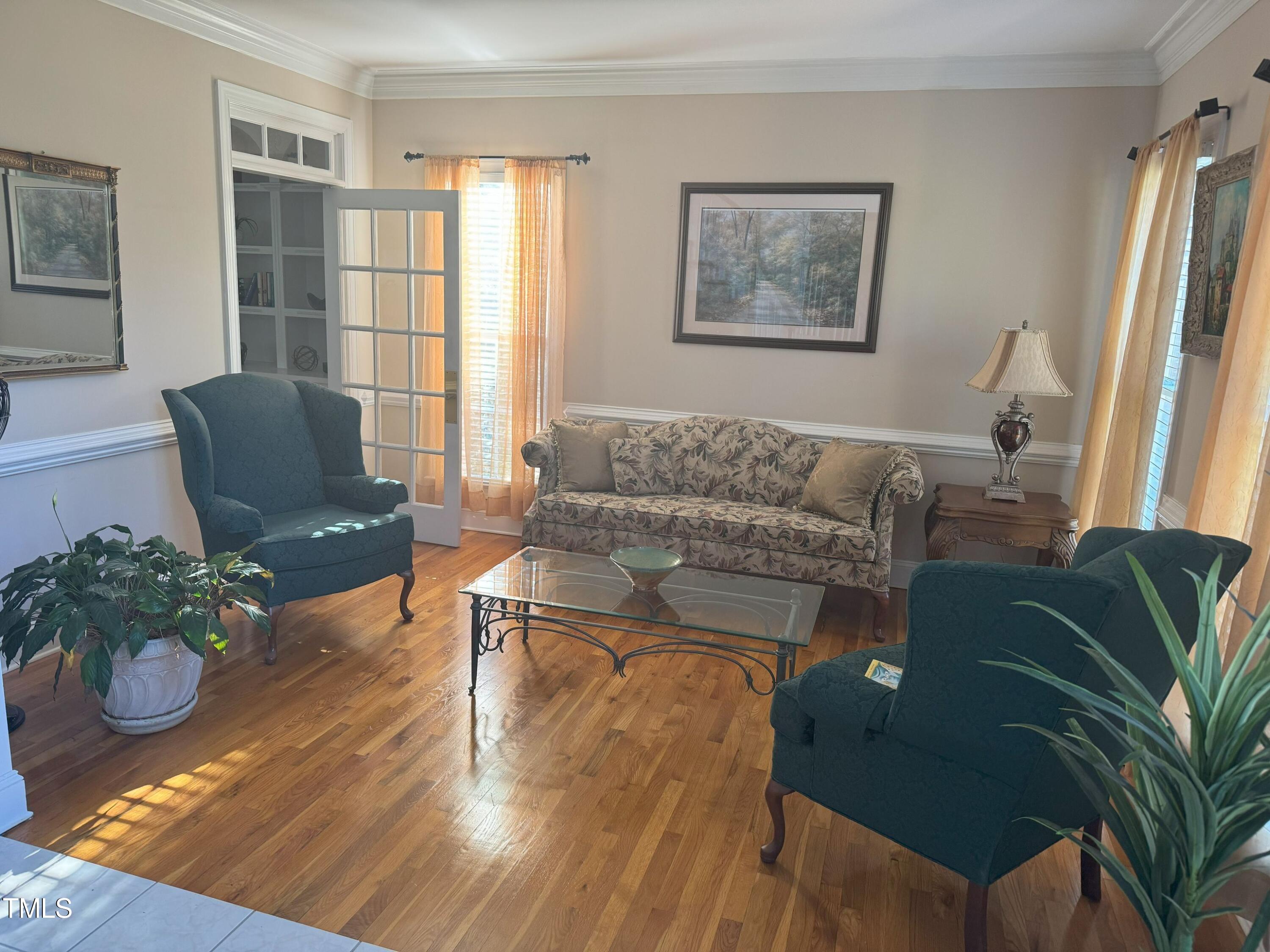 2212 Moss Pointe Lane Raleigh, NC 27606 - Photo 11 of 27 a living room with furniture and a potted plant