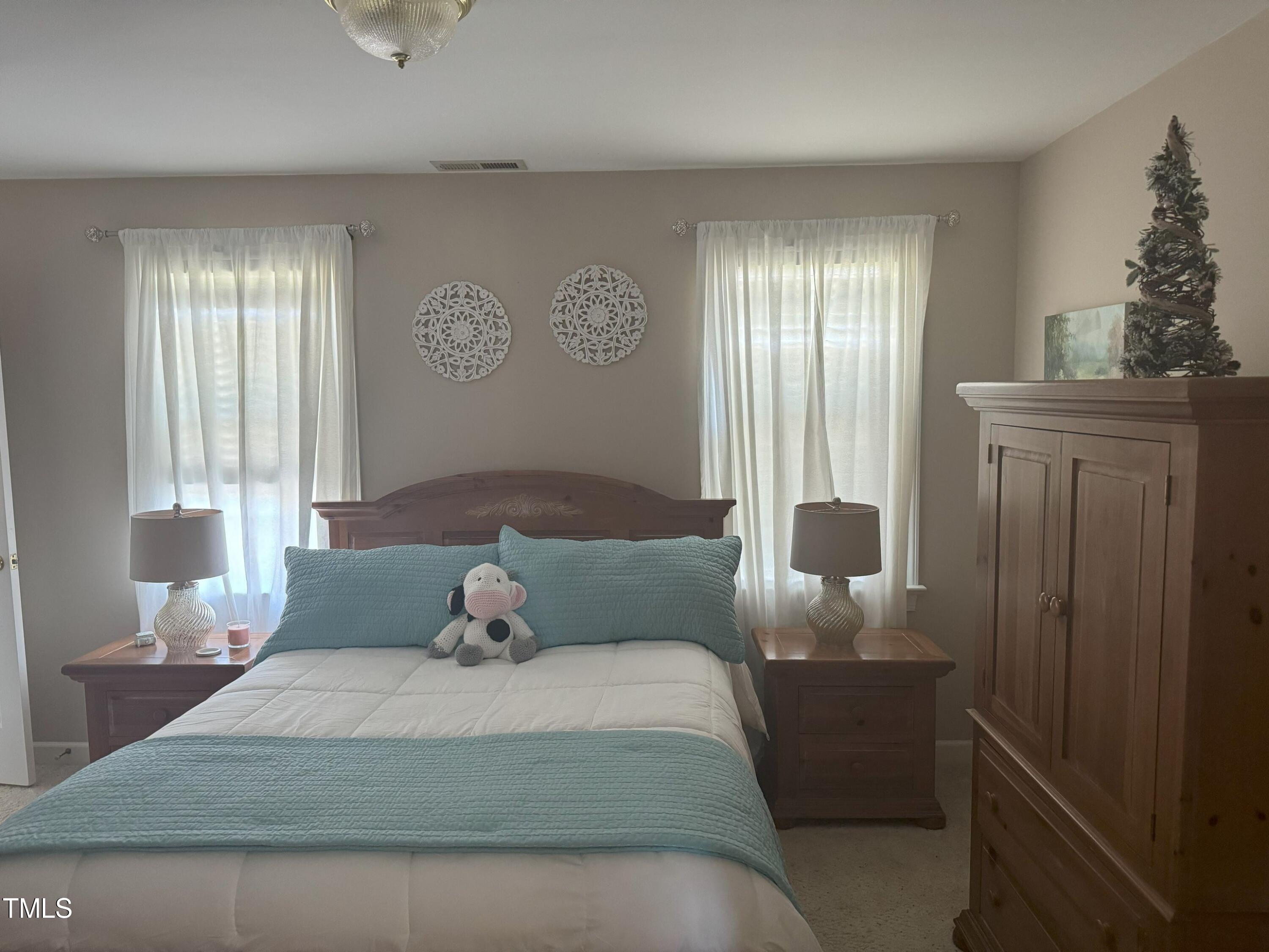 2212 Moss Pointe Lane Raleigh, NC 27606 - Photo 18 of 27 a bedroom with a bed and window