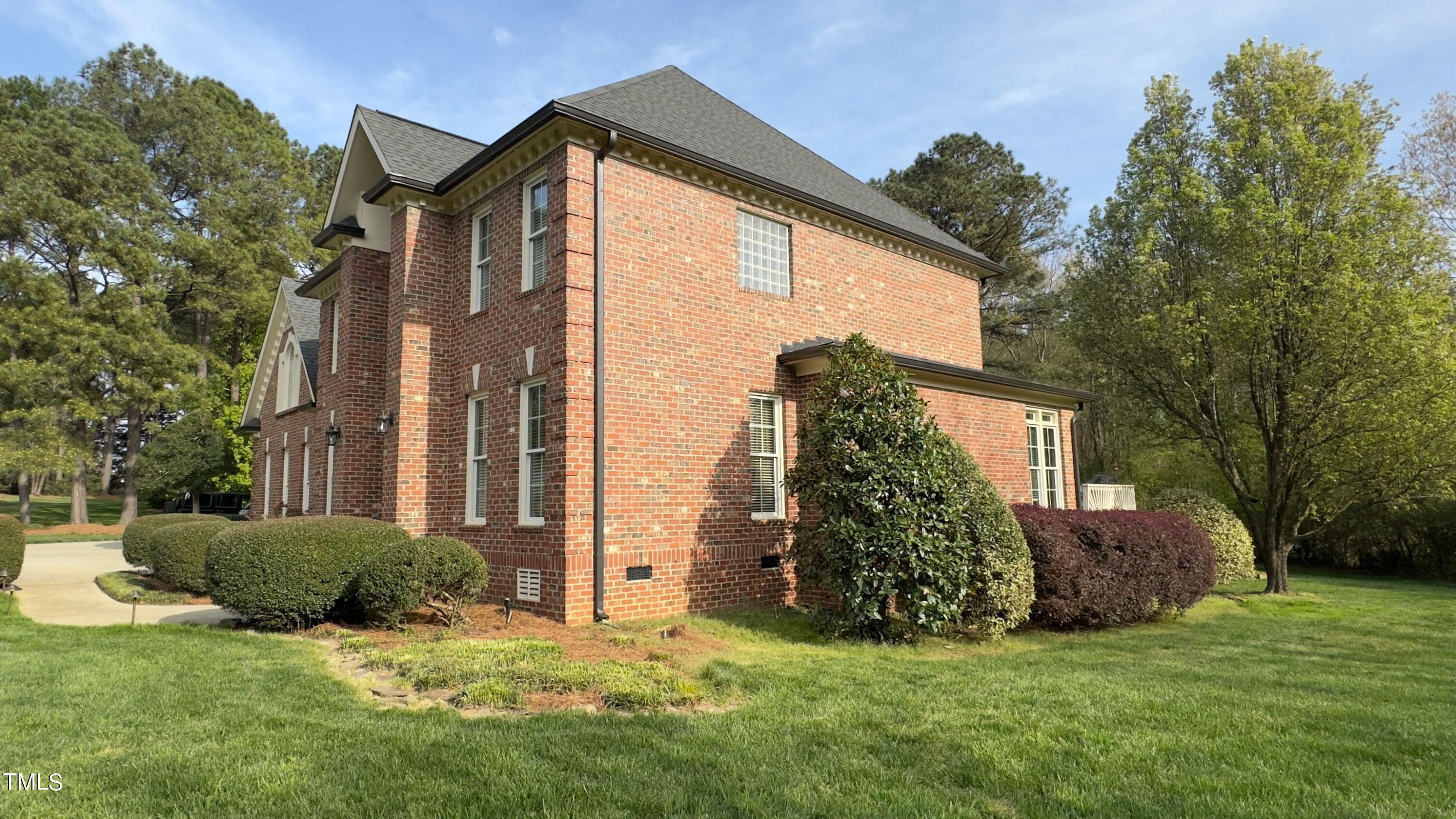 2212 Moss Pointe Lane Raleigh, NC 27606 - Photo 24 of 27 a view of a house with a yard