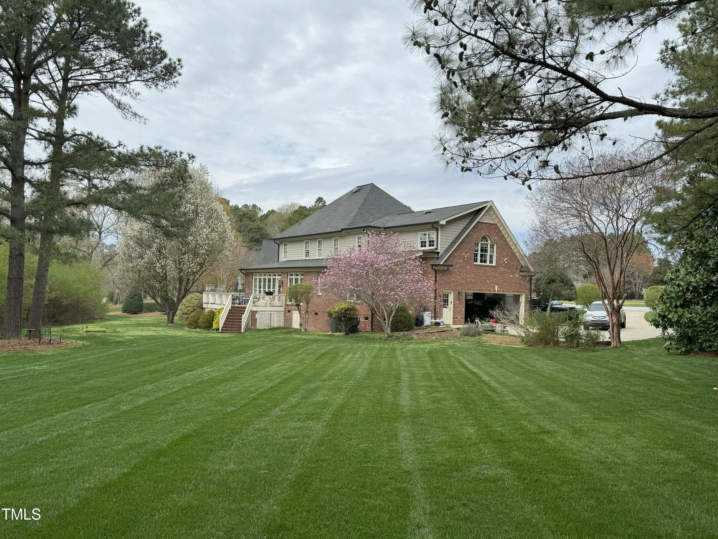 2212 Moss Pointe Lane Raleigh, NC 27606 - Photo 3 of 27 a front view of house with yard and green space