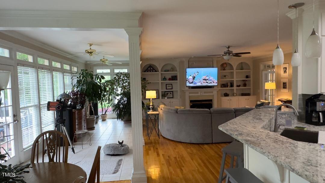2212 Moss Pointe Lane Raleigh, NC 27606 - Photo 10 of 27 a living room with fireplace furniture and a flat screen tv