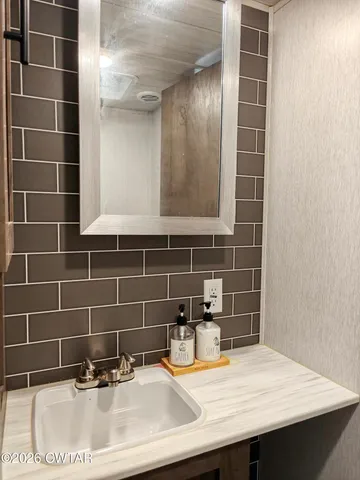 a bathroom with a sink and a mirror