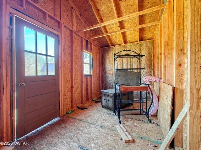 a room with furniture and a window