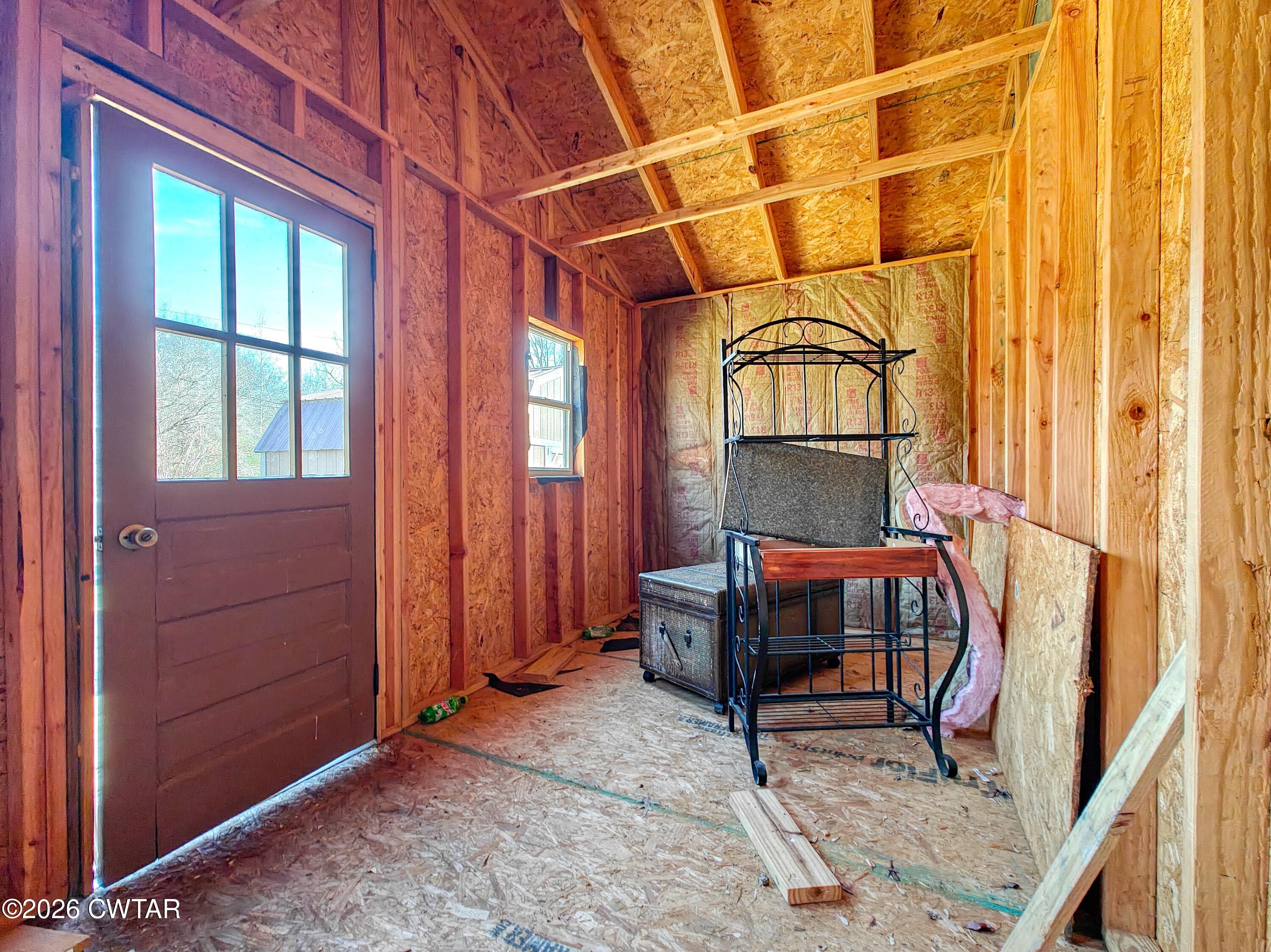 202 Eva Beach Drive Eva, TN 38333 - Photo 21 of 34 a room with furniture and a window