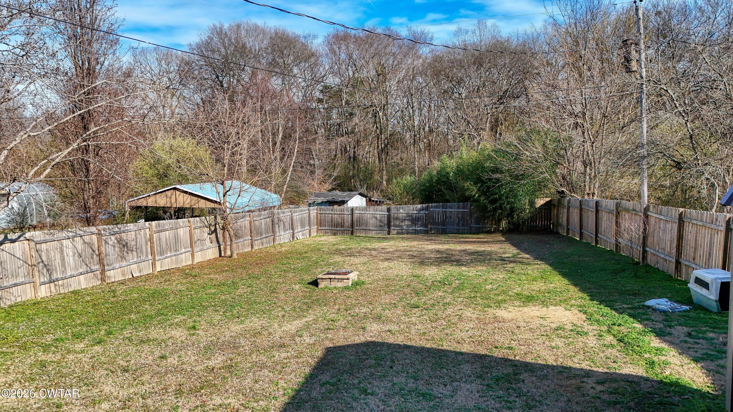 202 Eva Beach Drive Eva, TN 38333 - Photo 23 of 34 a view of a backyard with white house