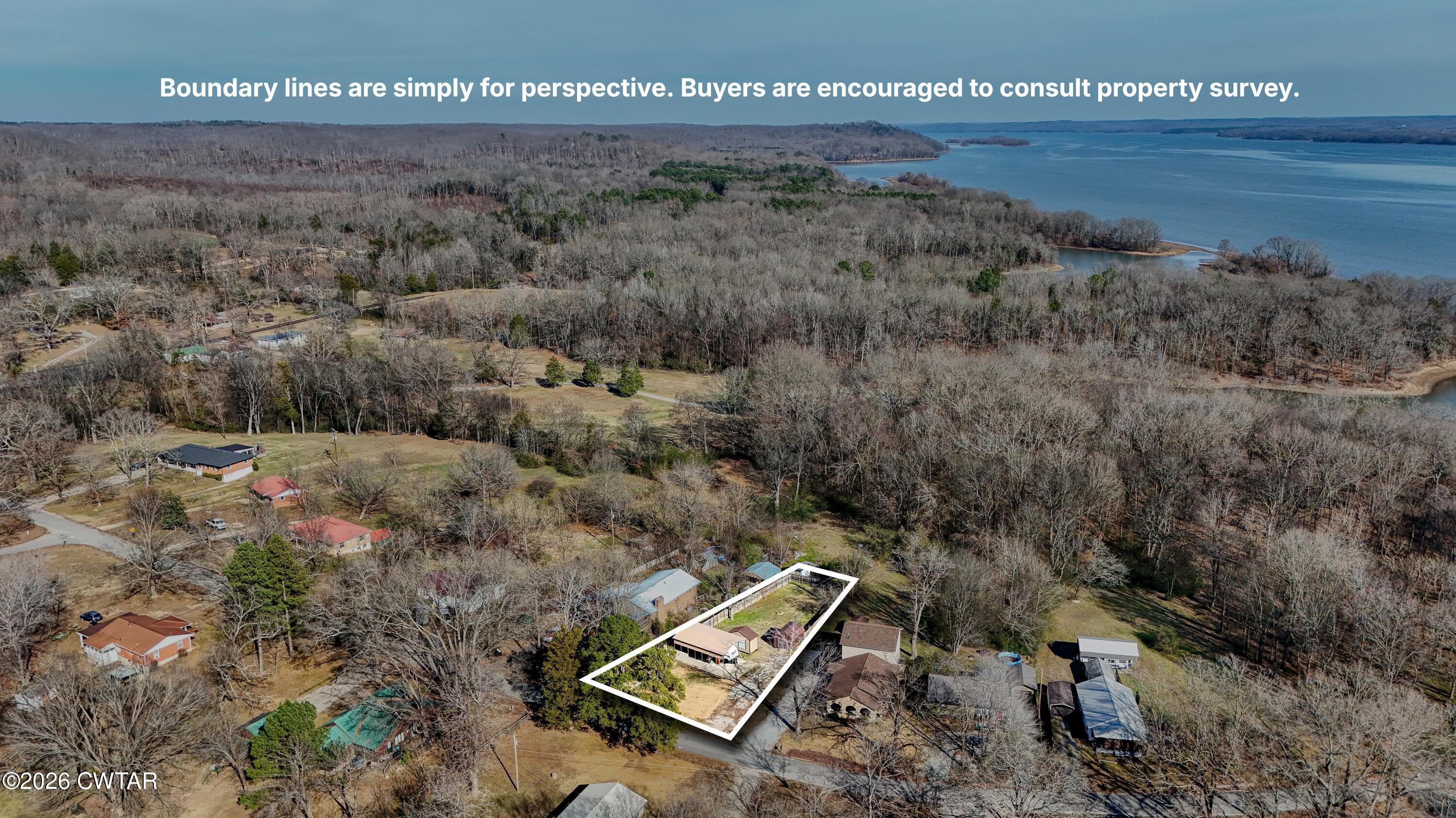 202 Eva Beach Drive Eva, TN 38333 - Photo 24 of 34 a view of a dry yard with trees