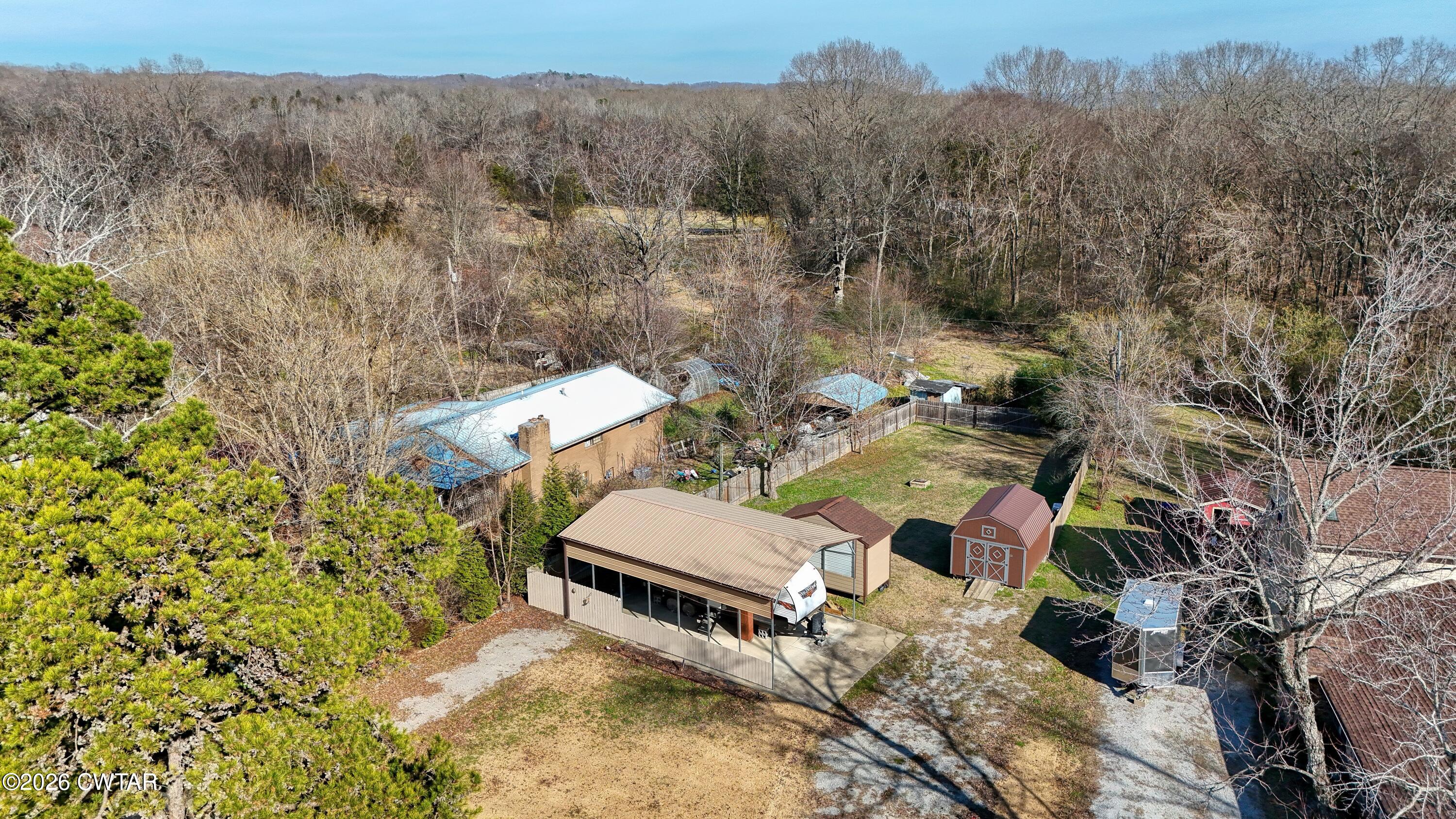 202 Eva Beach Drive Eva, TN 38333 - Photo 29 of 34 an aerial view of a house with a yard