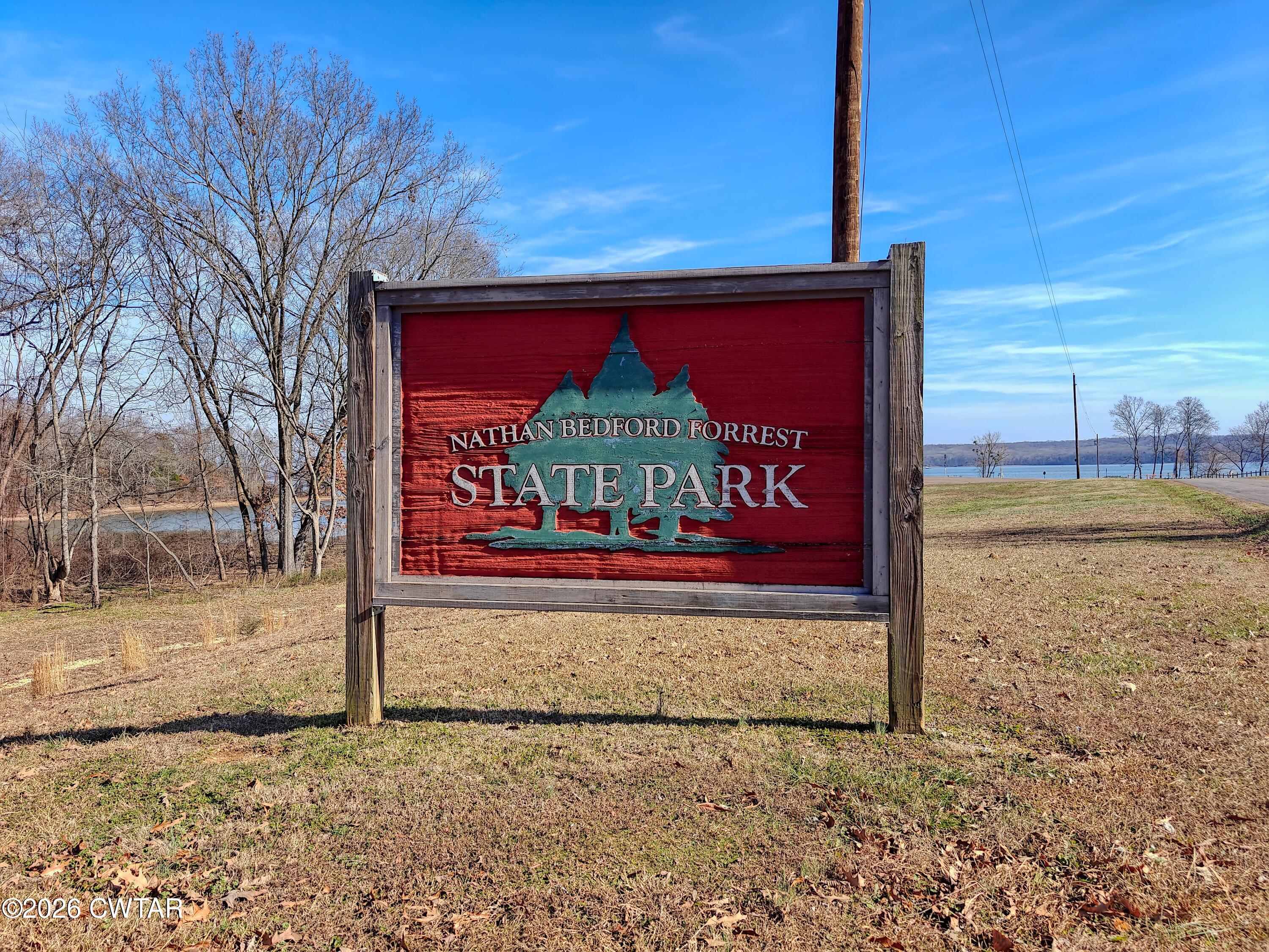 202 Eva Beach Drive Eva, TN 38333 - Photo 33 of 34 a view of a door with a house in the background
