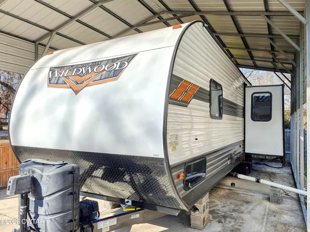 a view of a garage with wooden wall