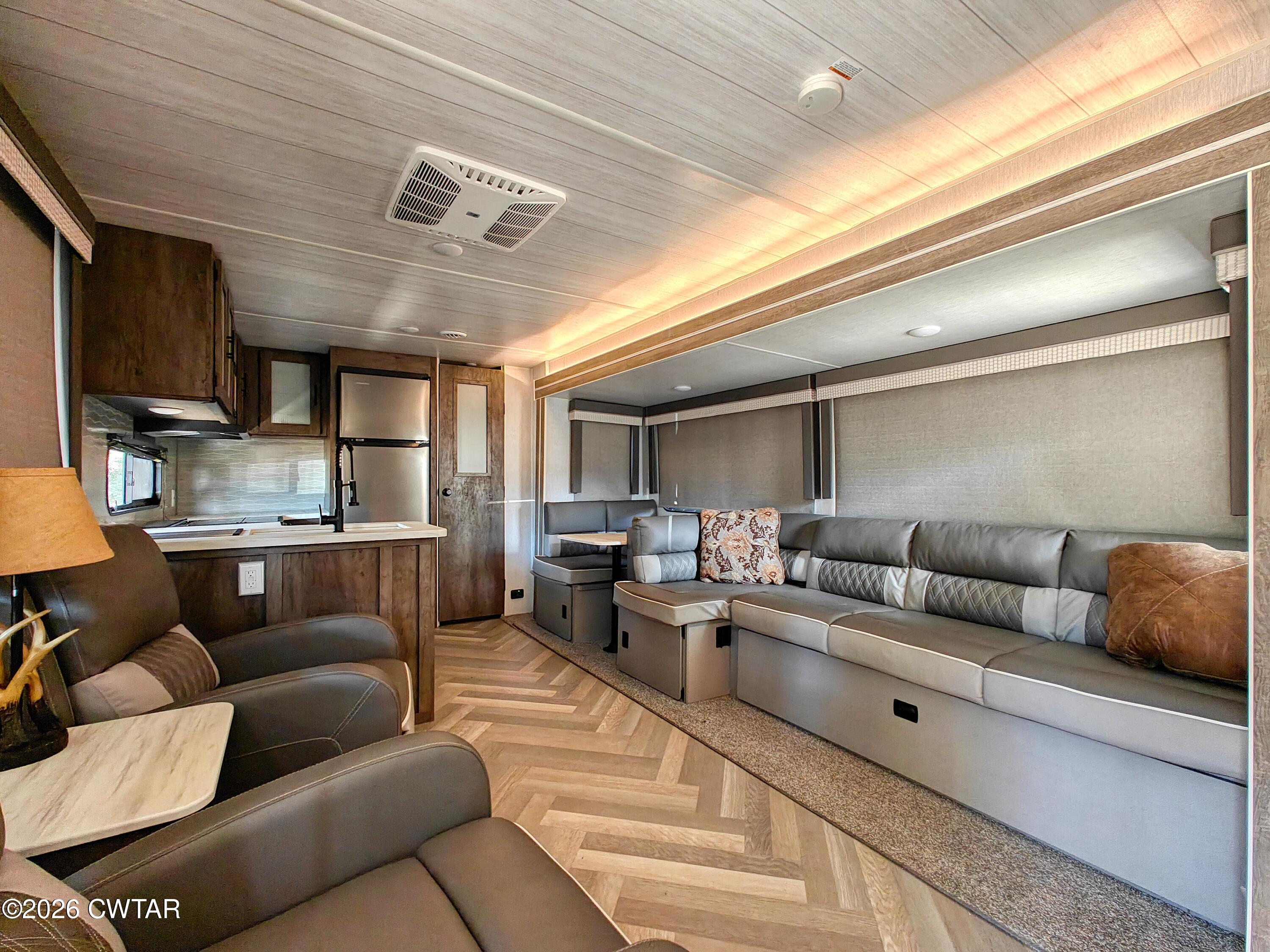 202 Eva Beach Drive Eva, TN 38333 - Photo 9 of 34 a living room with furniture and a view of kitchen