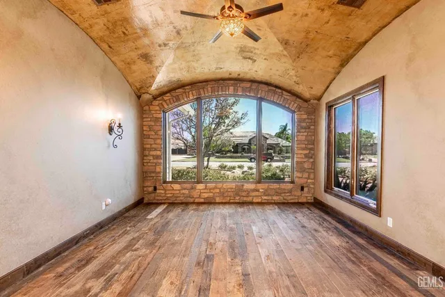 a view of a room with wooden floor