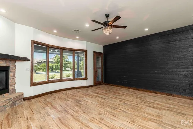 a view of a house with garden and a sitting area