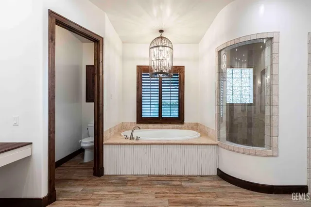 a view of a house with swimming pool and sitting area