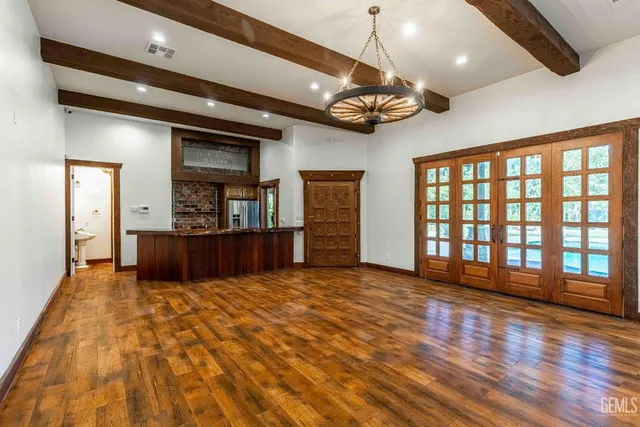 a view of a room with wooden floor and chair