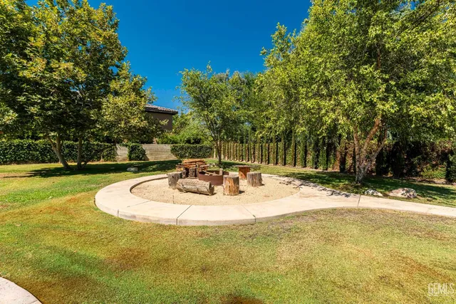 an empty room with wooden floor and cabinet