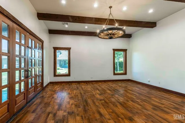 a kitchen with granite countertop a sink and cabinets