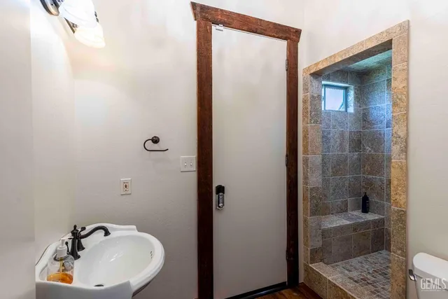 a view of swimming pool with outdoor seating and plants