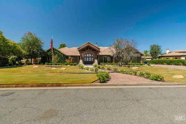 an entrance view of a house with wooden floor