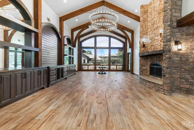 a large kitchen with kitchen island a sink stainless steel appliances and cabinets