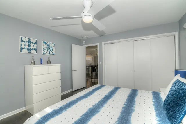 a bedroom with a bed and a dresser