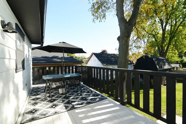 a view of a wooden deck with a patio