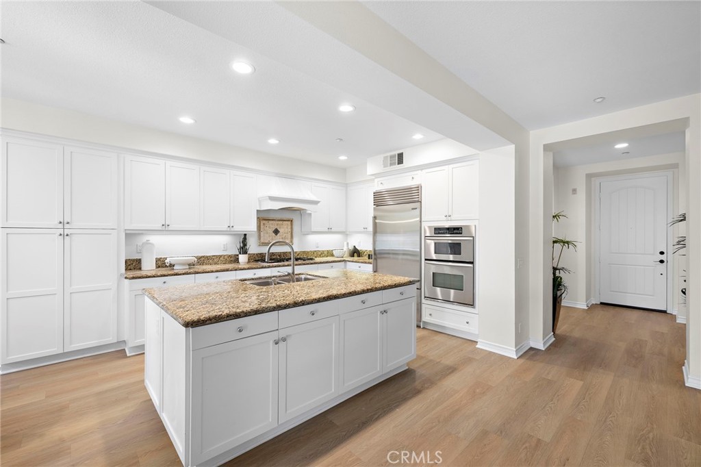 47 Tuscany Ladera Ranch, CA 92694 - Photo 9 of 28 a kitchen with a sink stove and refrigerator