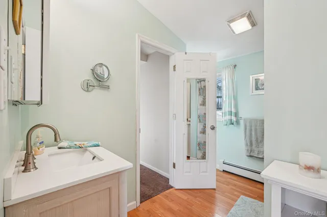 a bathroom with a sink and a mirror