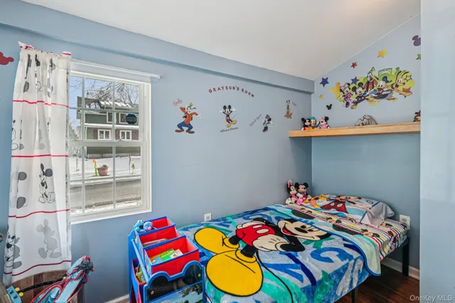 a room with toys and a view of bathroom