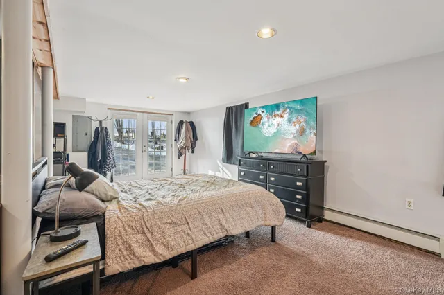 a bedroom with furniture and a window