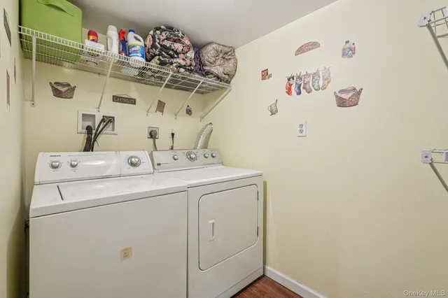 a view of a balcony with two chairs and a potted plant
