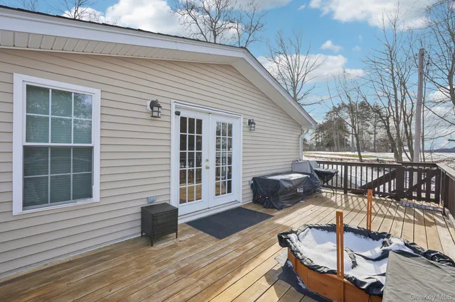 a view of a balcony with wooden floor