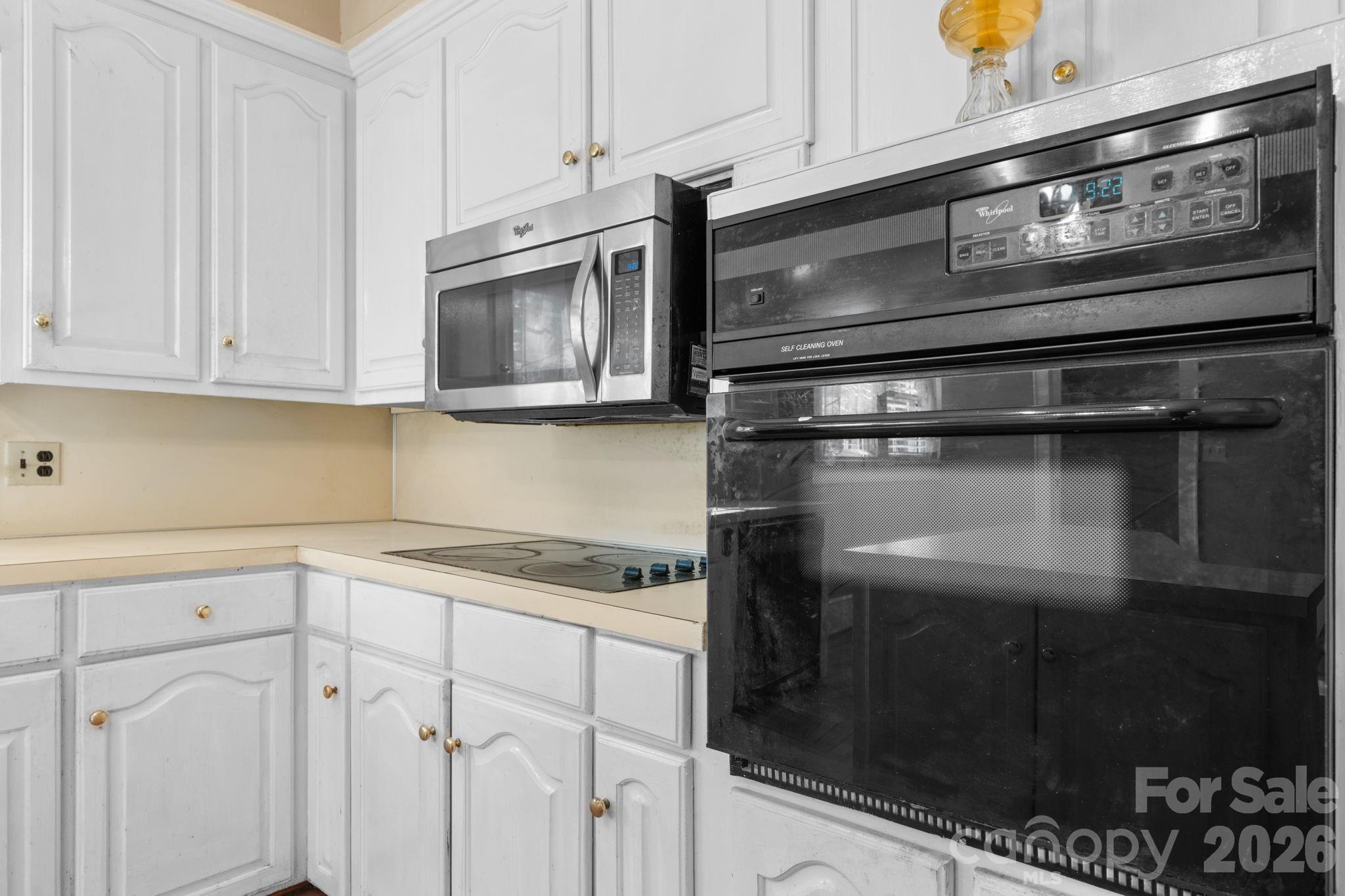 144 Hunter Bridge Road Stony Point, NC 28678 - Photo 11 of 45 a kitchen with granite countertop a stove microwave and sink