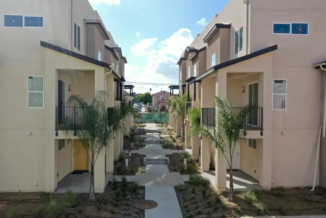 a view of path along with residential buildings