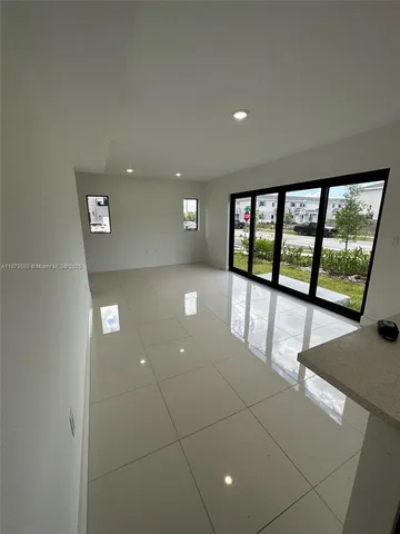 a view of a hallway with staircase