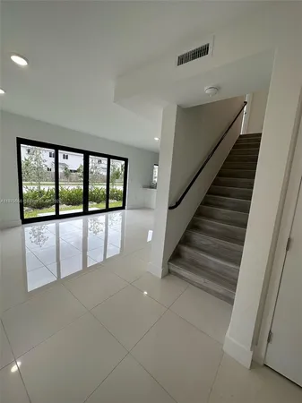 a view of an empty room with a window