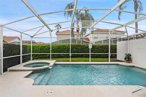 a view of a swimming pool with a yard
