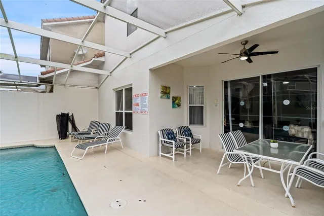 a view of a patio with a table and chairs