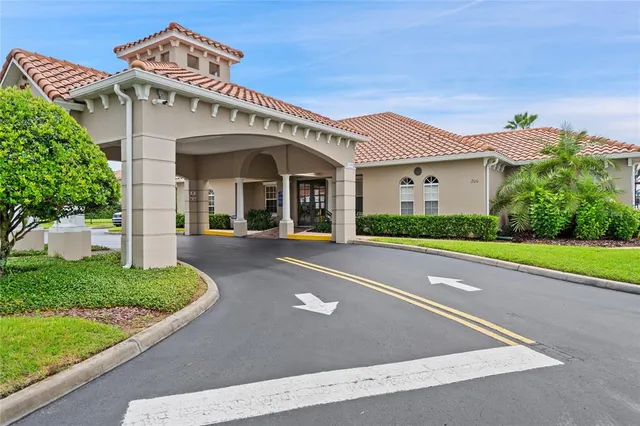 a view of a white building with a large windows