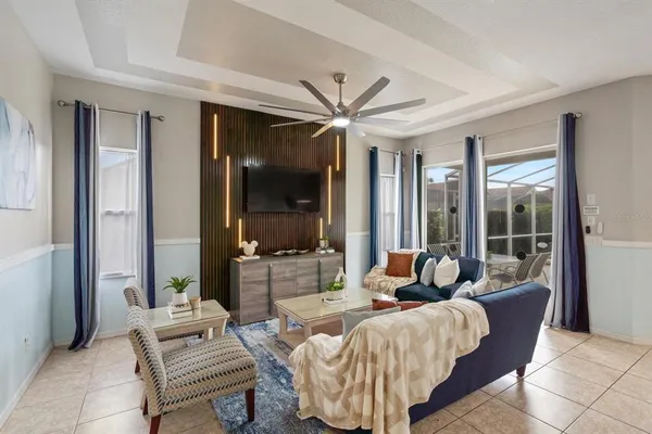a living room with furniture and a large window