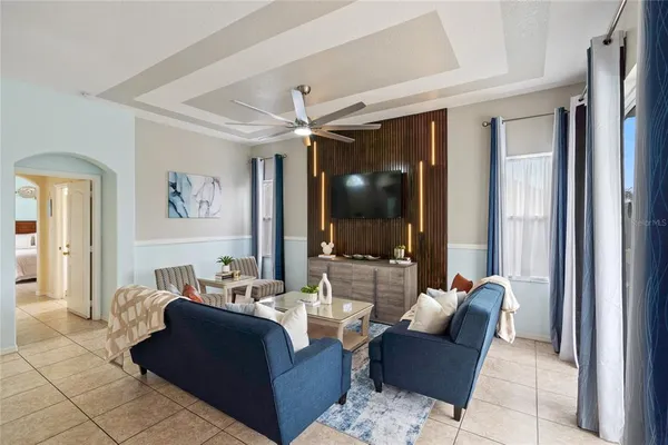 a living room with furniture and a flat screen tv