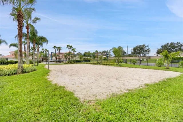 a view of yard with swimming pool and green space